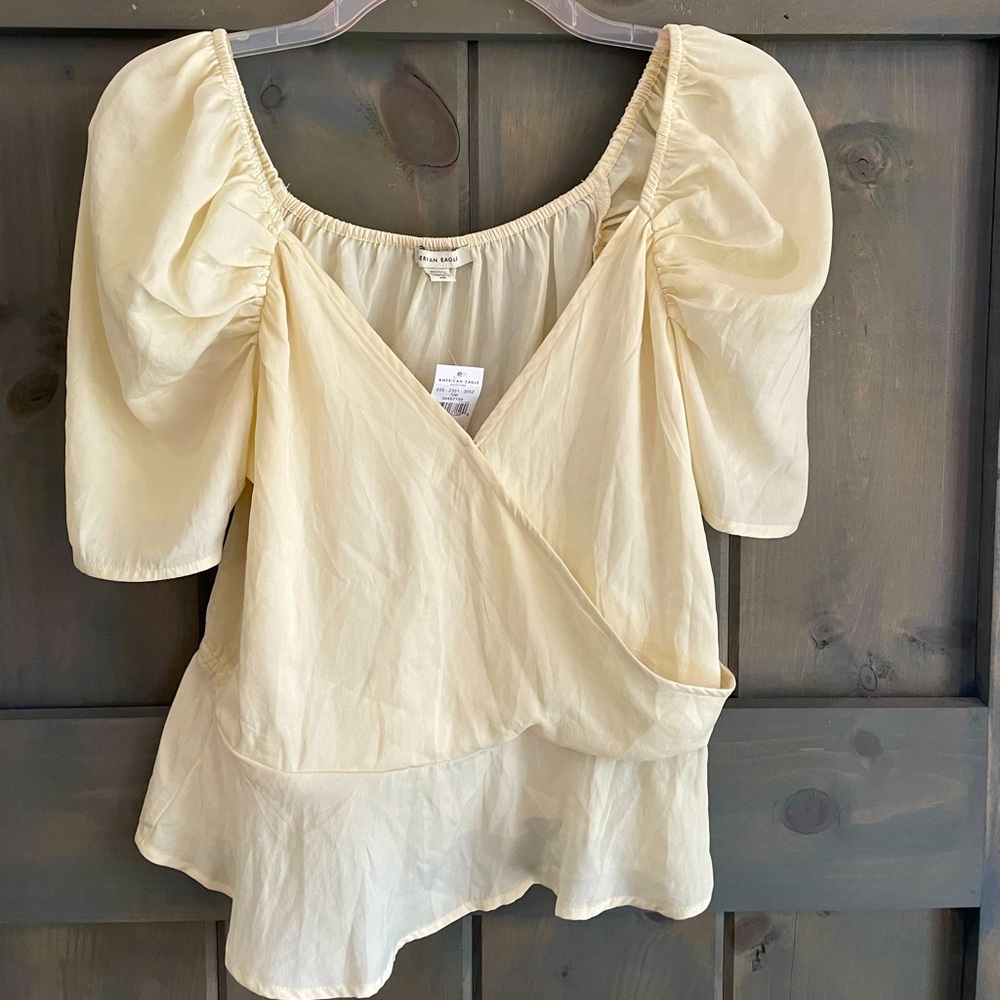American Eagle 🦅  NWT
Cream silky top 
Size M